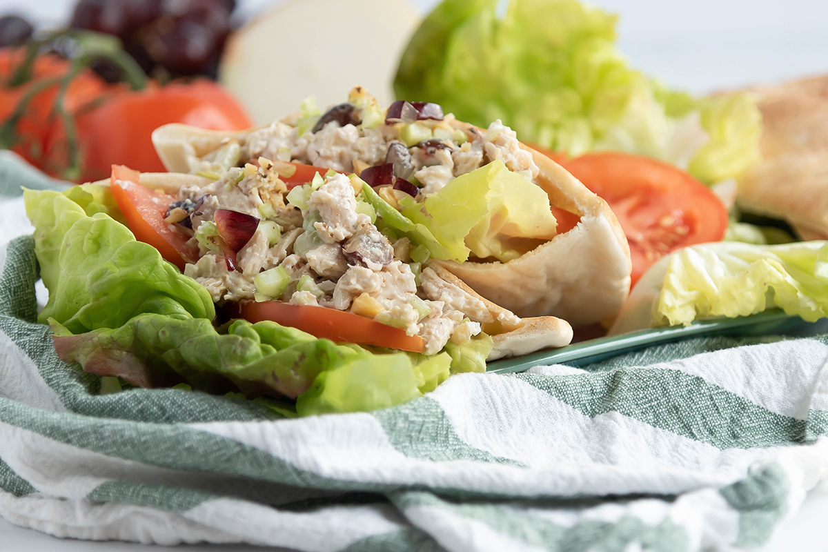 chicken salad stuffed into pitas on plate