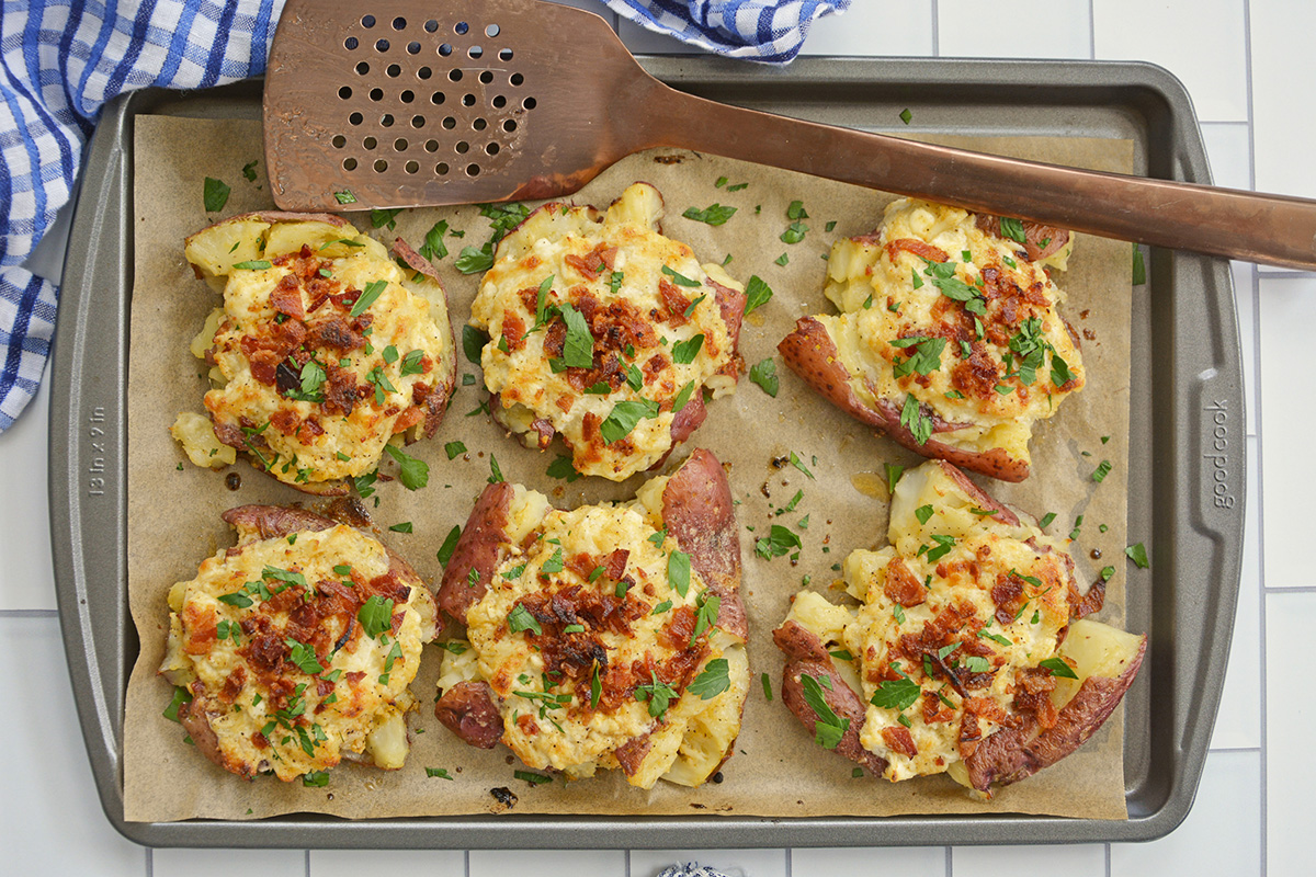 baking sheet of crab smashed potatoes