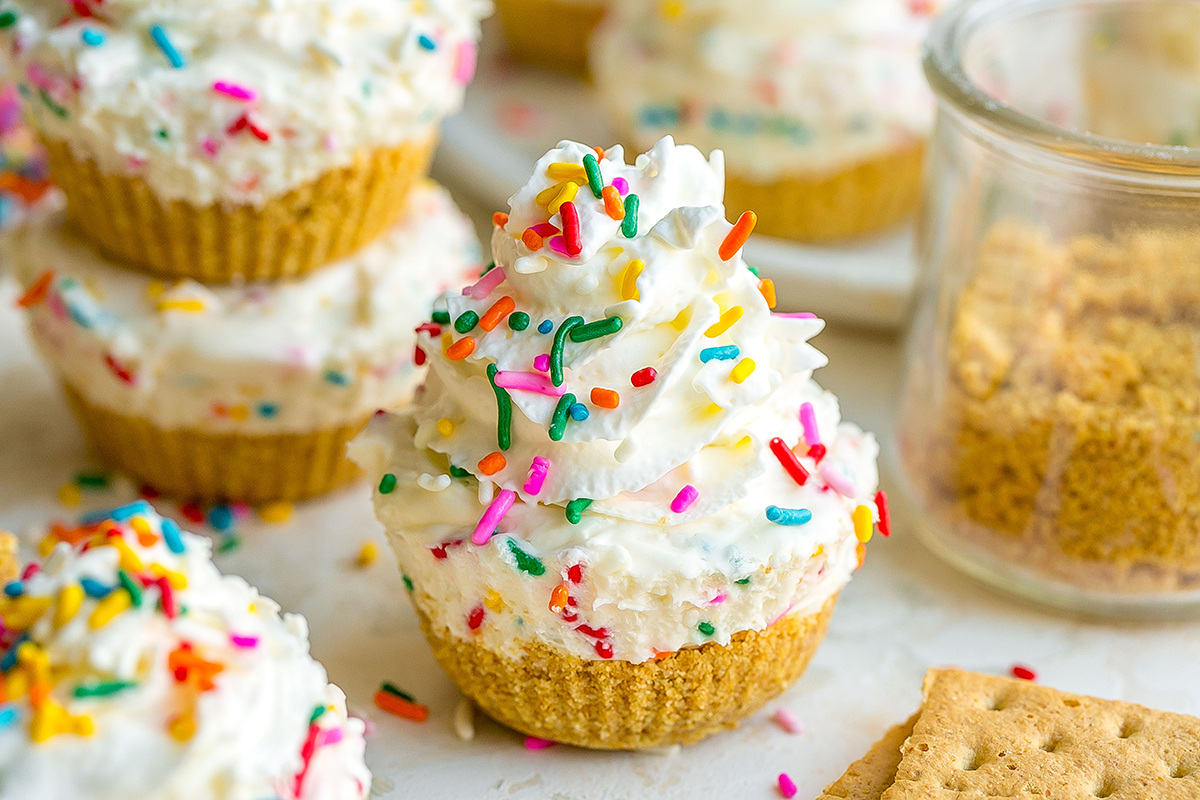 mini cheesecake bite topped with whipped cream