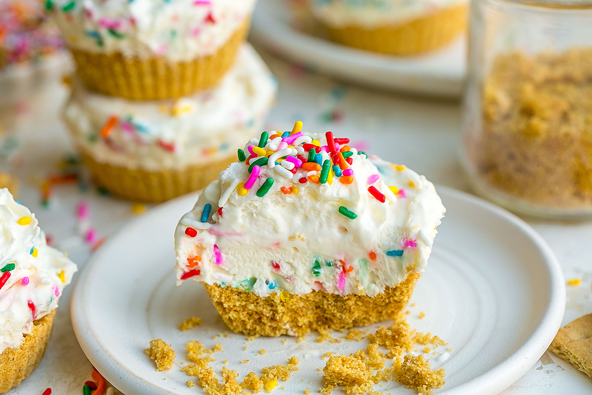 mini funfetti cheesecake cut in half on plate