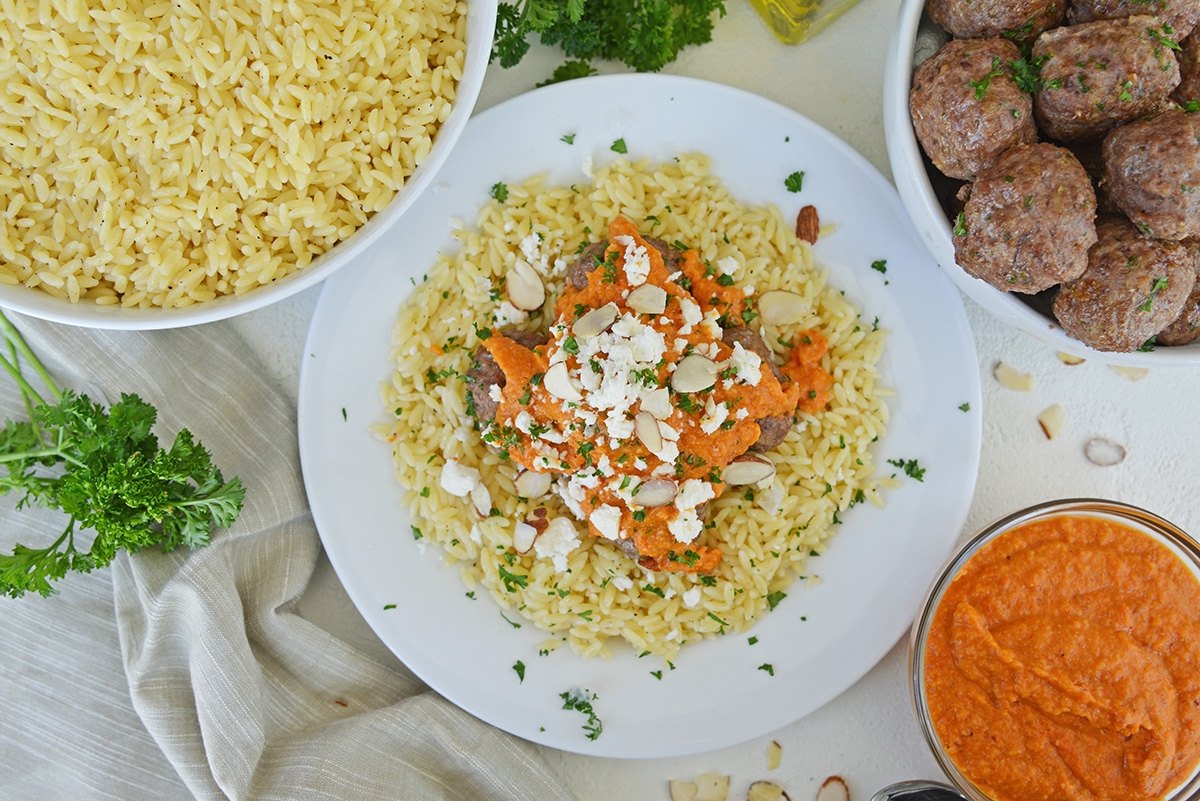 overhead shot of plate of orzo and lamb meatballs