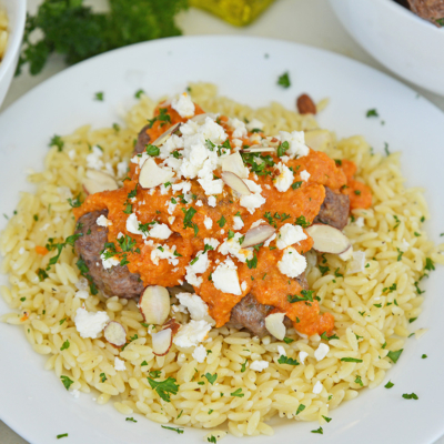 angled shot of plate of orzo and lamb meatballs