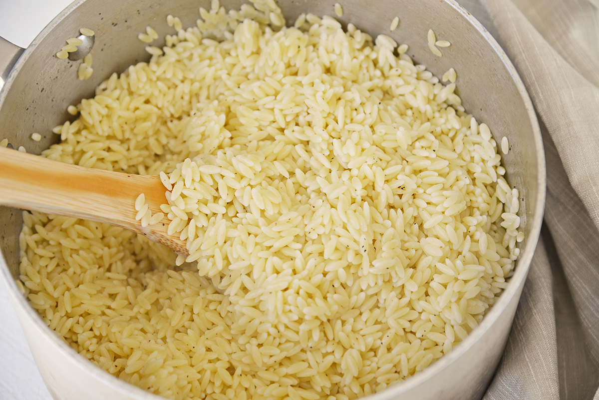 angled shot of cooked orzo in pot