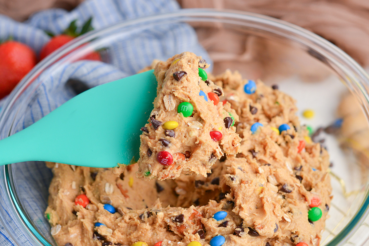 spatula in bowl of monster cookie dip