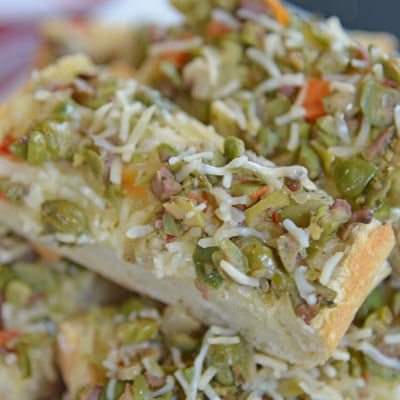 angled shot of slices of olive cheese bread