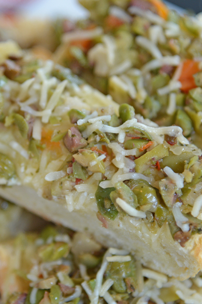 angled shot of slices of olive cheese bread