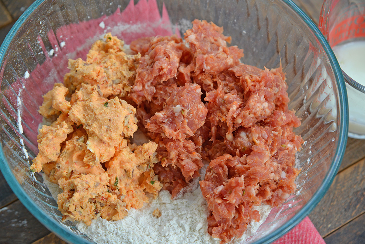 angled shot of pimento cheese sausage balls ingredients in bowl