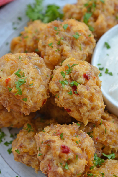 close up angled shot of plate of pimento cheese sausage balls