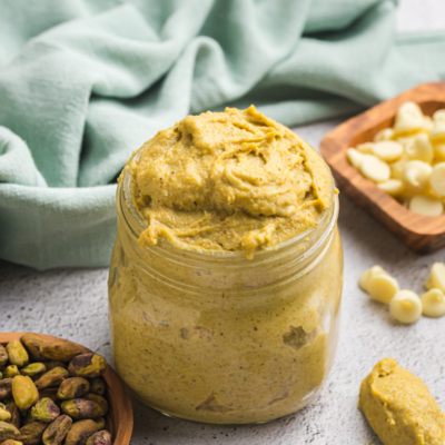 angled shot of jar of pistachio cream